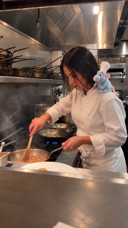 Chef cooking with ShoulderChef on her shoulder